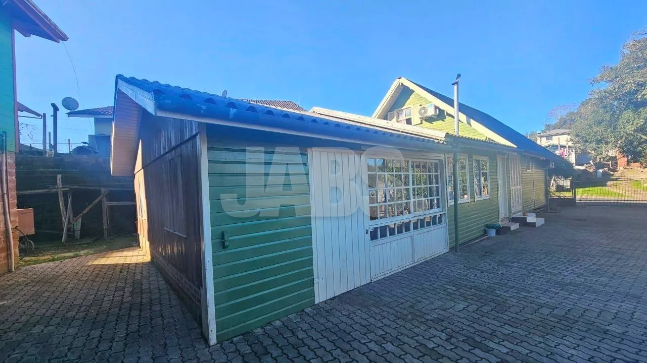 Terreno com 2 casas alugadas na Vila do Cedro, foto 1
